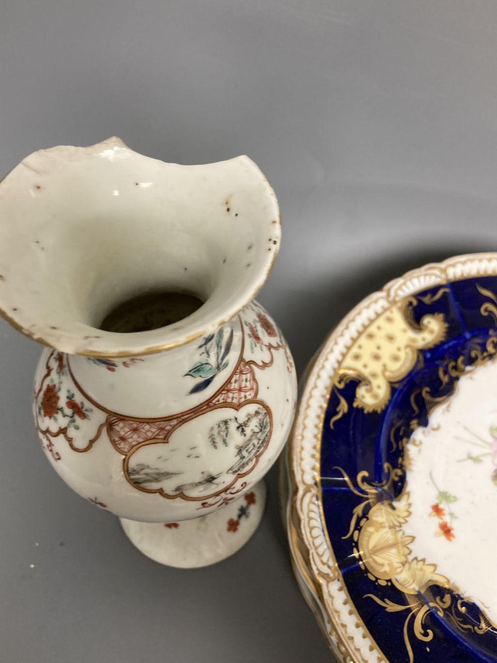 A Worcester Kakiemon vase, c.1765, a 19th century Paris porcelain plate and three tea bowls and 19th century English porcelain plates e